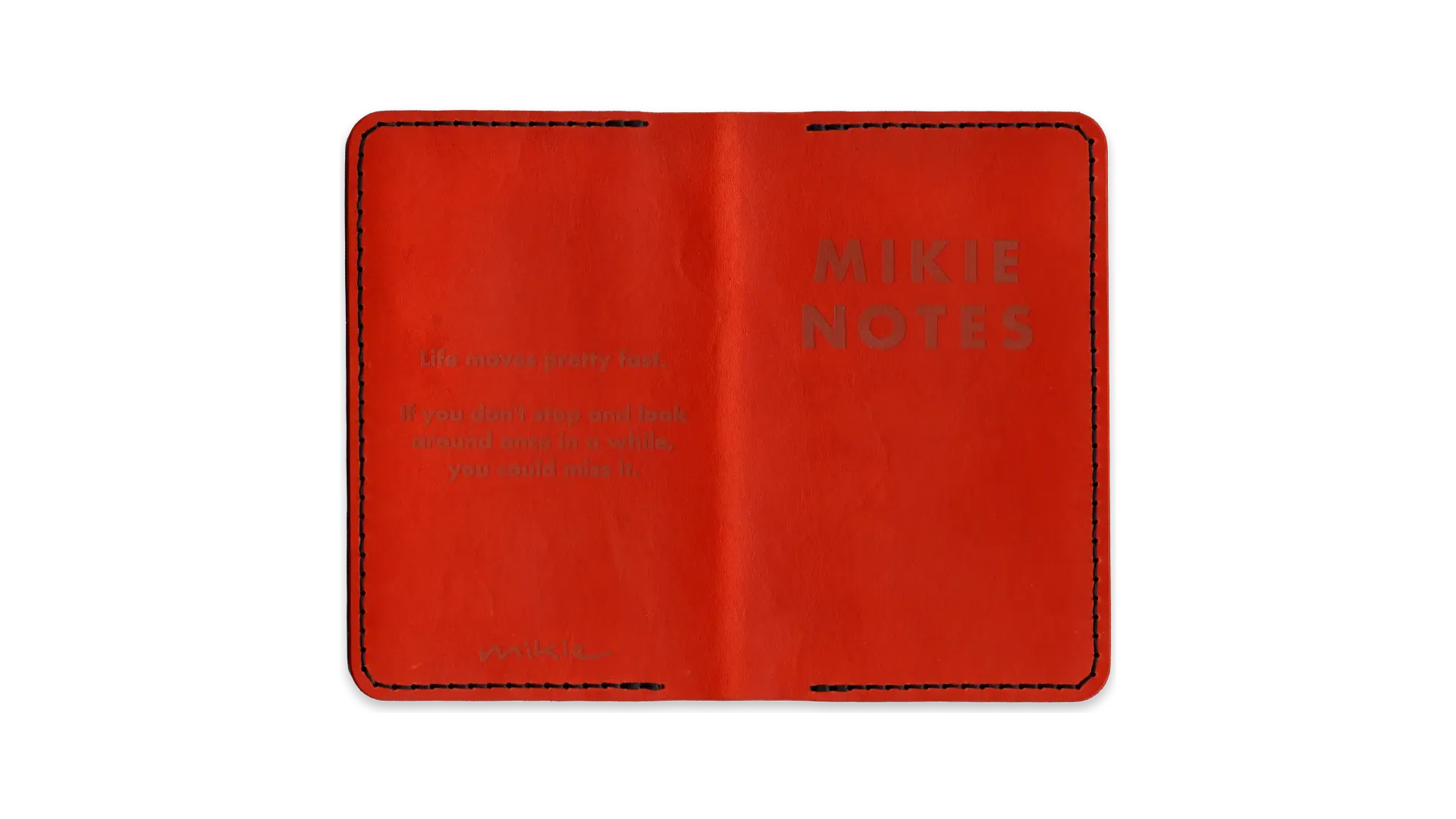 A scanned image of a one-of-a-kind pocket notebook leather folio, in orange with black thread.