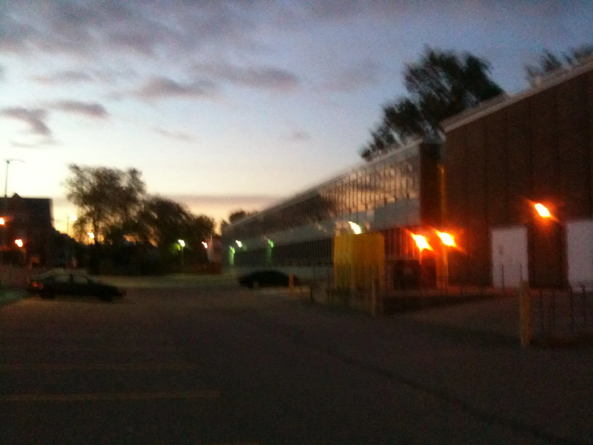 A blurry photo from an iPhone 4, taken in the Fall of 2011, outside the Story Arts Centre campus of Centennial College around sunset, located in East York.